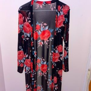 Calf length black and red duster.